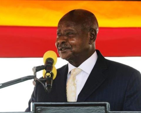 Ugandan President Yoweri Museveni waving to supporters at a campaign rally in rural Uganda
